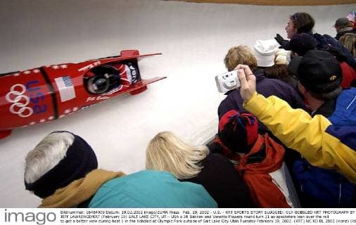 Feb. 19, 2002 - U.S. - KRT SPORTS STORY SLUGGED: OLY-BOBSLED KRT PHOTOGRAPH BY JEFF LAWRENCE KRT (February 19) SALT LAKE CITY, UT-- USA s Jill Bakken and Vonetta Flowers round turn 11 as spectators lean over the rail to get a better view during heat 1 in the bobsled at Olympic Park outside of Salt Lake City Utah Tuesday February 19, 2002. (KRT) NC KD BL 2002 (Horiz) (lde) News Archive - Feb. 19, 2002 - ZUMAm67