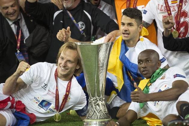Ivan Rakitic, Vitolo and Stephane Mbia with the trophy - Sevilla FC vs. SL Benfica Lisboa - UEFA Europa League Final - - Turin - 14 05 2014 Pic PhilipxOldham Sportimage EDITORIAL USE ONLY. No use with unauthorised audio, video, data, fixture lists, club league logos or live services. Online in-match use limited to 120 images, no video emulation. No use in betting, games or single club league player publications.
