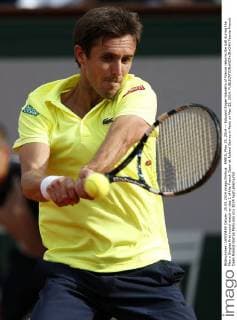 PARIS, May 25, 2014 -- Edouard Roger-Vasselin of France returns the ball during the Men s Singles first round match on day 1 of the French Open at Roland Garros in Paris on May 25, 2014. 
