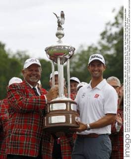 May 25, 2014 - Fort Worth, TX, USA - Club President Chuck Sherer presents Adam Scott with the Leonard Trophy for winning the Crowne Plaza Invitational at Colonial in Fort Worth, Texas, Sunday, May 25, 2014. Crowne Plaza Invitational at Colonial - ZUMAm67