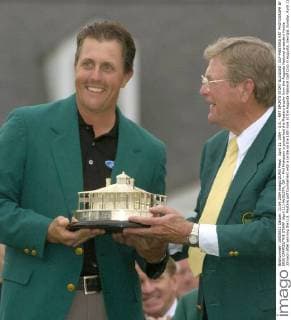 April 11, 2004 - U.S. - KRT SPORTS STORY SLUGGED: GLF-MASTERS KRT PHOTOGRAPH BY ERIK CAMPOS THE STAMP (April 11) AUGUSTA, GA -- Phil Mickelson is presented the Masters trophy from the Augusta National president Hootie Johnson after winning the U.S. Masters golf tournament with a birdie on the 18th hole at the Augusta National Golf Club in Augusta, Georgia, Sunday, April 11, 2004. This was Mickelson s first major tournament win. (nk) 2004 News Archive - April 11, 2004 - ZUMAm67