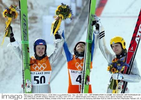 Feb. 13, 2002 - U.S. - KRT SPORTS STORY SLUGGED: OLY-SKIJUMP: KRT PHOTOGRAPH BY JOE RIMKUS JR. MIAMI HERALD (February 13) SALT LAKE CITY, UT-- Medal winners Adam Malysz, of Poland, silver; Simon Ammann, Switzerland, gold; and Matti Hannawald, Finland, bronze in the flower ceremony of the mens Ski Jumping Individual K120 at Utah Olympic Park Wednesday February 13, 2002. (MI) NC KD - Feb. 13, 2002 - ZUMAm67
