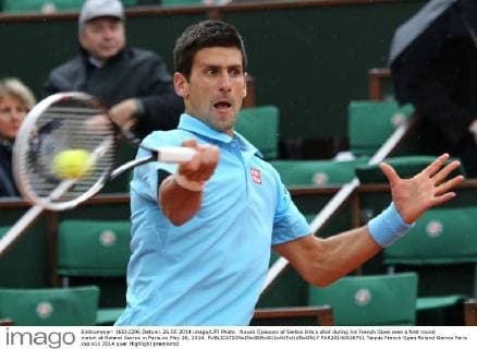 Novak Djokovic of Serbia hits a shot during his French Open men s first round match at Roland Garros in Paris on May 26, 2014.  PAR20140526701