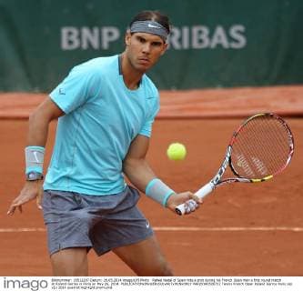 Rafael Nadal of Spain hits a shot during his French Open men s first round match at Roland Garros in Paris on May 26, 2014.  PAR20140526712