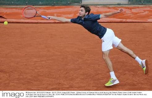 Gilles Simon of France hits a shot during his French Open men s first round match at Roland Garros in Paris on May 26, 2014.  PAR20140526738