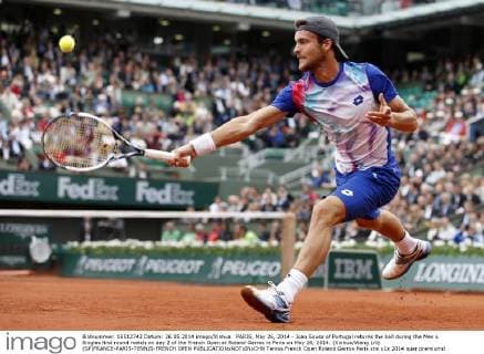PARIS, May 26, 2014 - Joao Sousa of Portugal returns the ball during the Men s Singles first round match on day 2 of the French Open at Roland Garros in Paris on May 26, 2014. (Xinhua Wang Lili) (SP)FRANCE-PARIS-TENNIS-FRENCH OPEN 