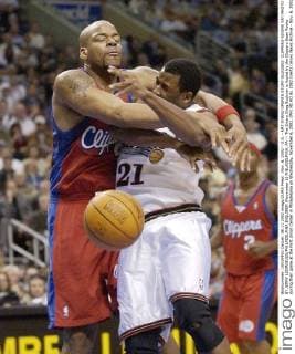 Nov. 6, 2002 - U.S. - KRT STAND SPORTS STORY SLUGGED: CLIPPERS-SIXERS KRT PHOTO BY JERRY LODRIGUSS PHILADELPHIA INQUIRER (November 6) PHILADELPHIA, PA -- The Sixers Greg Buckner is fouled by the Clippers Sean Rooks during their game at the First Union Center in Philadelphia on Wednesday, November 6, 2002. (PH) NC KD BL 2002 (Vert) (mvw) News Archive - Nov. 6, 2002 - ZUMAm67