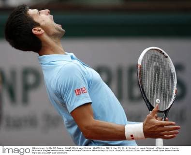 (140528) -- PARIS, May 28, 2014 (Xinhua) -- Novak Djokovic of Serbia reacts during the Men s Singles second round match at Roland Garros in Paris on May 28, 2014. 