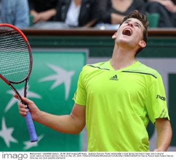 Austrian Dominic Thiem reacts after a shot during his French Open men s second round match at Roland Garros in Paris on May 29, 2014.  PAR20140529732