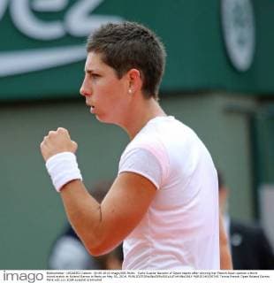 Carla Suarez Navarro of Spain reacts after winning her French Open women s third round match at Roland Garros in Paris on May 30, 2014.  PAR20140530741