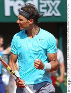Rafael Nadal of Spain reacts after a shot during his French Open men s third round match at Roland Garros in Paris on May 31, 2014.  PAR20140531813