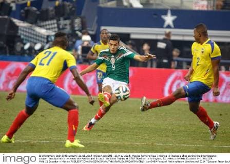 31 May 2014: Mexico forward Raul Jimenez (9) takes a shot during the international soccer friendly match between the Mexico and Ecuador National Teams at AT&T Stadium in Arlington, TX. Mexico defeats Ecuador 3-1. SOCCER: MAY 31 Ecuador v Mexico Icon0489 EDITORIAL USE ONLY