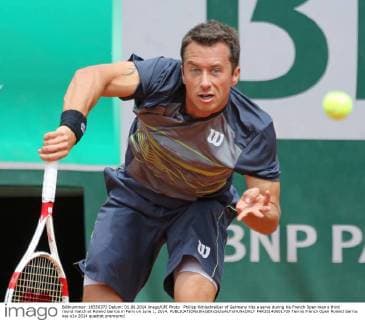 Philipp Kohlschreiber of Germany hits a serve during his French Open men s third round match at Roland Garros in Paris on June 1, 2014.  PAR20140601709