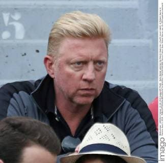 Boris Becker watches the French Open men s fourth round match at Roland Garros in Paris on June 1, 2014.  PAR20140601802