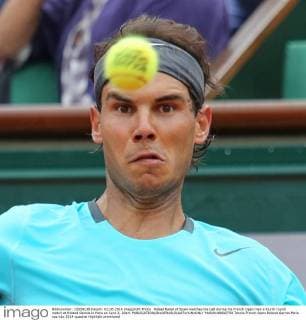 Rafael Nadal of Spain watches the ball during his French Open men s fourth round match at Roland Garros in Paris on June 2, 2014.  PAR20140602750