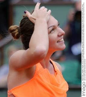 Simona Halep of Romania reacts after winning her French Open women s fourth round match at Roland Garros in Paris on June 2, 2014.  PAR20140602819