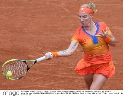 Svetlana Kuznetsova of Russia hits a shot during her French Open women s quarterfinal match .  PAR20140604724