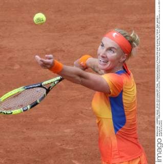 Svetlana Kuznetsova of Russia hits a serve during her French Open women s quarterfinal match .  PAR20140604725