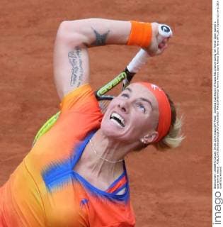 Svetlana Kuznetsova of Russia hits a serve during her French Open women s quarterfinal match .  PAR20140604726