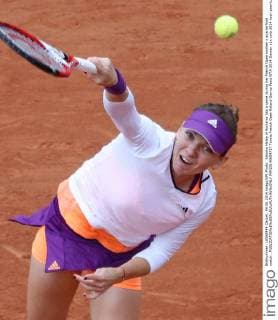 Simona Halep of Romania hits a serve during her French Open women s quarterfinal match .  PAR20140604727