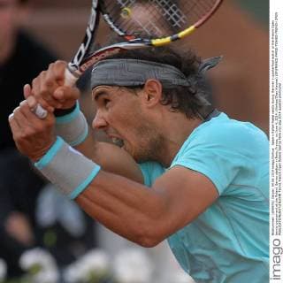 Spain s Rafael Nadal reacts during the men s quarterfinal match at the French Open tennis tournament at the Roland Garros stadium in Paris, France, on June 4, 2014. (Xinhua Chen Xiaowei) (SP)FRANCE-PARIS-TENNIS-FRENCH OPEN 