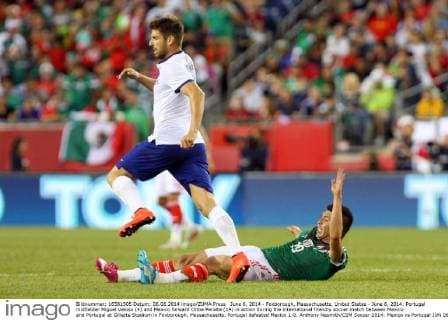 June 6, 2014 - Foxborough, Massachusetts, United States - June 6, 2014: Portugal midfielder Miguel Veloso (4) and Mexico forward Oribe Peralta (19) in action during the international friendly soccer match between Mexico and Portugal at Gillette Stadium in Foxborough, Massachusetts. Portugal defeated Mexico 1-0. Anthony Nesmith CSM Soccer 2014: Mexico vs Portugal JUN 06 - ZUMAc04