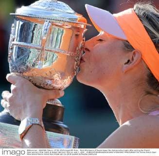 Maria Sharapova of Russia kisses the championship trophy after winning her French Open women s final match at Roland Garros in Paris on June 7, 2014. .  PAR20140607703