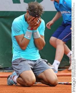 Rafael Nadal of Spain reacts after winning his French Open men s final match at Roland Garros in Paris on June 8, 2014.  PAR20140608703