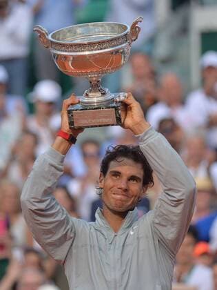 June 08 2014: Rafael Nadal of Spain lifts the trophy overhead to claim the Men s Singles title at the French Open 2014, played at Stade Roland Garros, Paris, France TENNIS: JUN 08 French Open - Men s Final Icon259140608003 EDITORIAL USE ONLY