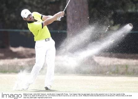 Paul Casey hits his approach shot to the second hole in the first round of the 114th U.S. Open at Pinehurst No. 2 in Pinehurst North Carolina on June 12, 2014.  PIN20140612138