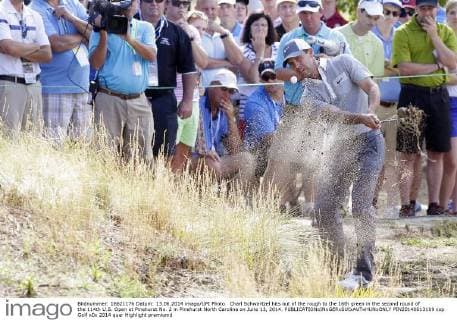 Charl Schwartzel hits out of the rough to the 16th green in the second round of the 114th U.S. Open at Pinehurst No. 2 in Pinehurst North Carolina on June 13, 2014.  PIN20140613109