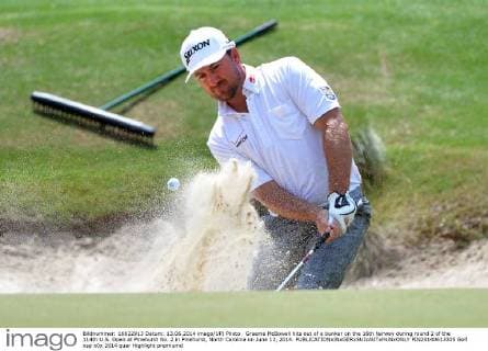 Graeme McBowell hits out of a bunker on the 16th fairway during round 2 of the 114th U.S. Open at Pinehurst No. 2 in Pinehurst, North Carolina on June 13, 2014.  PIN20140613335