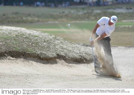Phil Mickelson hits from a bunker on the 14th fairway during round 3 of the 114th U.S. Open at Pinehurst No. 2 in Pinehurst, North Carolina on June 14, 2014.  PIN20140614311