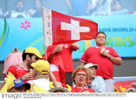 A Switzerland s fan cheers for his team before a Group E match of 2014 FIFA World Cup at the Estadio Nacional Stadium in Brasilia, June 15, 2014. 