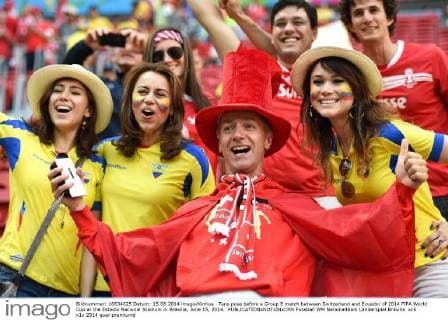 Fans pose before a Group E match between Switzerland and Ecuador of 2014 FIFA World Cup at the Estadio Nacional Stadium in Brasilia, June 15, 2014. 