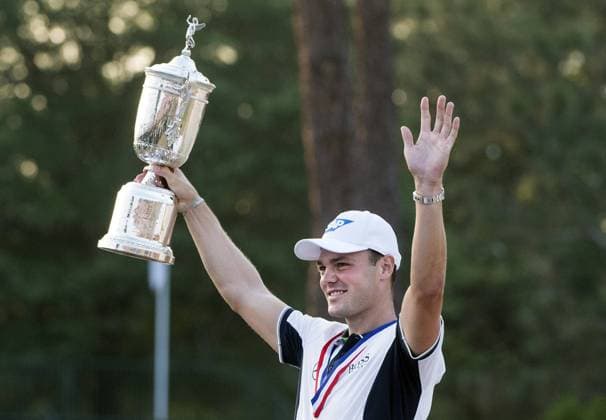 Martin Kaymer celebrates with the trophy after winning the 114th U.S. Open at Pinehurst No. 2 in Pinehurst, North Carolina on June 15, 2014. Kaymer finished nine under par with a four day score of 271.  PIN20140615327