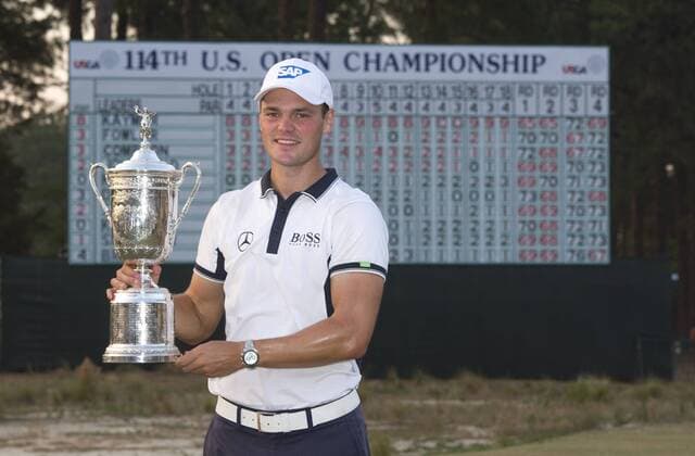 Martin Kaymer poses with the trophy after winning the 114th U.S. Open at Pinehurst No. 2 in Pinehurst, North Carolina on June 15, 2014. Kaymer finished nine under par with a four day score of 271.  PIN20140615339