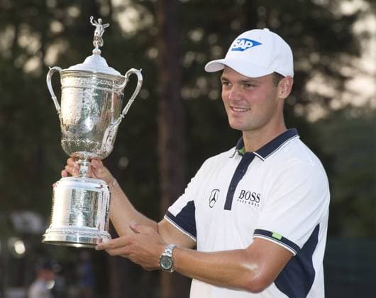 Martin Kaymer poses with the trophy after winning the 114th U.S. Open at Pinehurst No. 2 in Pinehurst, North Carolina on June 15, 2014. Kaymer finished nine under par with a four day score of 271.  PIN20140615341