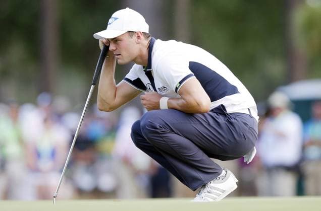 Martin Kaymer lines up a putt on the 15th hole in the final round of the 114th U.S. Open at Pinehurst No. 2 in Pinehurst North Carolina on June 15, 2014. Kaymer wins the 2014 U.S. Open with a score of 9 under par and a 4 day total of 271.  PIN20140615118