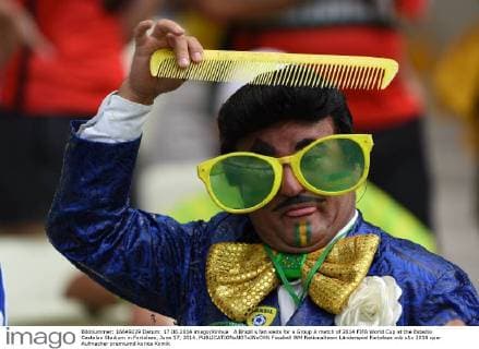 A Brazil s fan waits for a Group A match of 2014 FIFA World Cup at the Estadio Castelao Stadium in Fortaleza, June 17, 2014. 