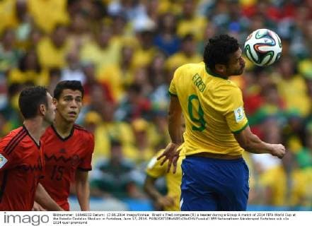 Brazil s Fred competes (R) a header during a Group A match of 2014 FIFA World Cup at the Estadio Castelao Stadium in Fortaleza, June 17, 2014. 