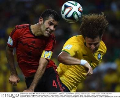 (140617) -- FORTALEZA, June 17, 2014 (Xinhua) -- Brazil s David Luiz (R) vies with Mexico s Rafael Marquez (L) during a Group A match between Brazil and Mexico of 2014 FIFA World Cup at the Estadio Castelao Stadium in Fortaleza, Brazil, June 17, 2014.The match concluded 0-0.(Xinhua Guo Yong)(rh) (SP)BRAZIL-FORTALEZA-WORLD CUP 2014-GROUP A-BRAZIL VS MEXICO 