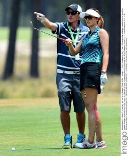 June 17, 2014 - Pinehurst, NC, USA - Michelle Wie and her caddie discuss the 13th green during a practice round for the U.S. Women s Open Championship at Pinehurst No. 2 on Tuesday, June 17, 2014 in Pinehurst, N.C. U.S. Women s Open Championship - ZUMAm67