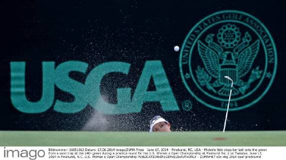 June 17, 2014 - Pinehurst, NC, USA - Michelle Wie chips her ball onto the green from a sand trap at the 14th green during a practice round for the U.S. Women s Open Championship at Pinehurst No. 2 on Tuesday, June 17, 2014 in Pinehurst, N.C. U.S. Women s Open Championship - ZUMAm67