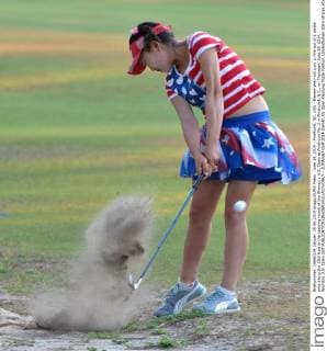 June 19, 2014 - Pinehurst, NC, USA - Eleven-year-old Lucy Li hits out of a waste area along the 10th hole in the opening round of the Women s U.S. Open at Pinehurst No. 2 in Pinehurst, N.C., on Thursday, June 19, 2014. Womens U.S. Open Golf - ZUMAm67