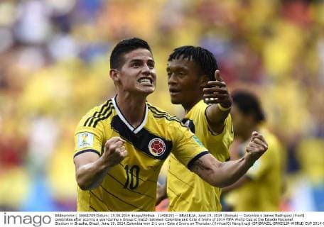 (140619) -- BRASILIA, June 19, 2014 (Xinhua) -- Colombia s James Rodriguez (front) celebrates after scoring a goal during a Group C match between Colombia and Cote d Ivoire of 2014 FIFA World Cup at the Estadio Nacional Stadium in Brasilia, Brazil, June 19, 2014.Colombia won 2-1 over Cote d Ivoire on Thursday.(Xinhua Qi Heng)(xzj) (SP)BRAZIL-BRASILIA-WORLD CUP 2014-GROUP C-COLOMBIA VS COTE D IVOIRE 