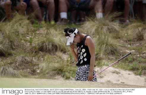 June 20, 2014 - Pinehurst, NC, USA - Lucy Li reacts to a face full of sand after hitting out of bunker on the eighth hole during the second day of the 2014 U.S. Women s Open at Pinehurst No. 2 in Pinehurst, N.C., Friday, June 20, 2014. Womens U.S. Open Golf - ZUMAm67