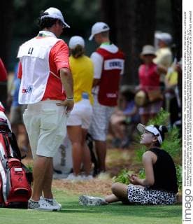 The youngest ever Women s U.S. Open competitor, 11-year-old Lucy Li, a 6th grader from Redwood Shores, California, sits down and waits on hole six during Round Two of the Women s U.S. Open at Pinehurst No. 2, in Pinehurst, North Carolina, on June 20, 2014.  PIN2014062024