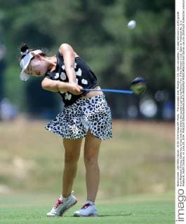 The youngest ever Women s U.S. Open competitor, 11-year-old Lucy Li, a 6th grader from Redwood Shores, California, drives hole two where she scored a par during Round Two of the Women s U.S. Open at Pinehurst No. 2, in Pinehurst, North Carolina, on June 20, 2014.  PIN2014062019