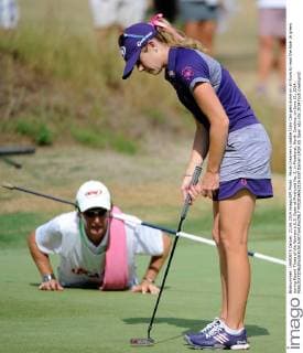 Paula Creamer s caddie Colin Can gets down on all fours to read the hole 16 green during Round Three of the Women s U.S. Open at Pinehurst No. 2, in Pinehurst, North Carolina, on June 21, 2014.  PIN2014062126